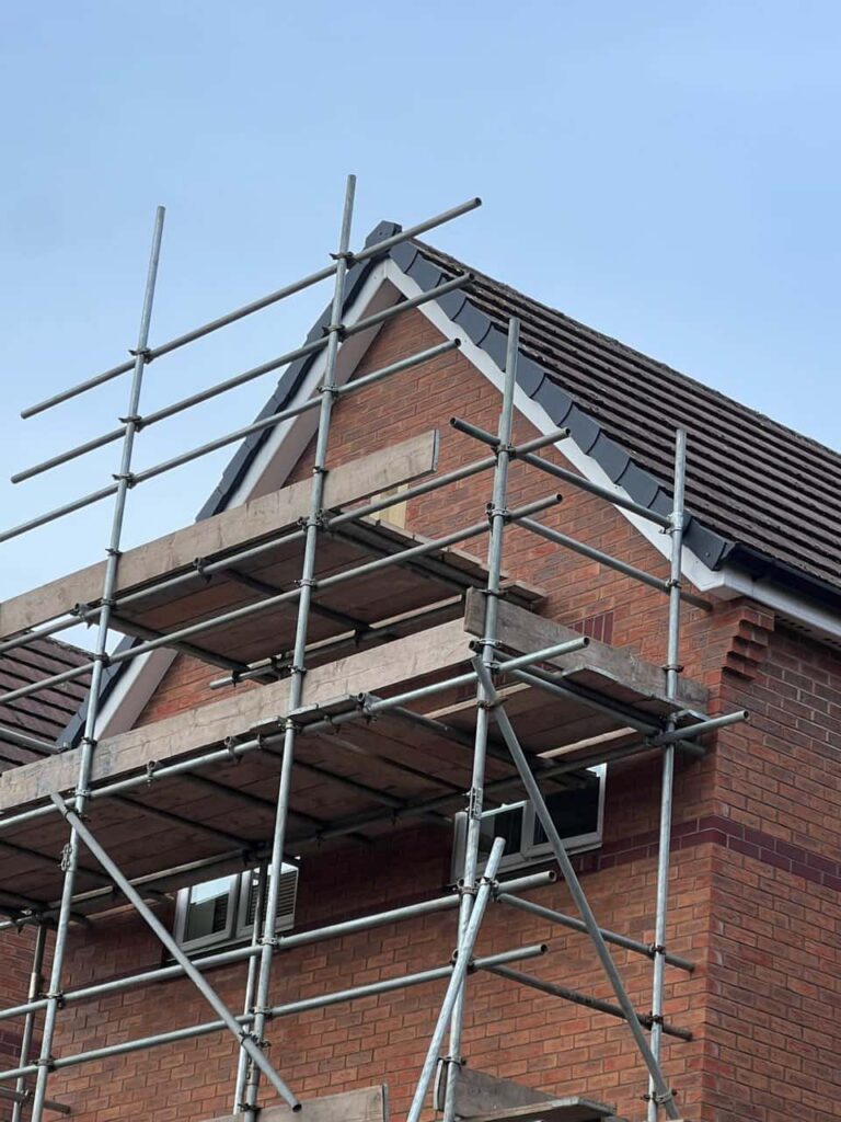 This is a photo of a roof which has just been repaired. There is a scaffold located at the gable end for access onto the roof. Works carried out by MCM Roofing Repairs Stockbridge